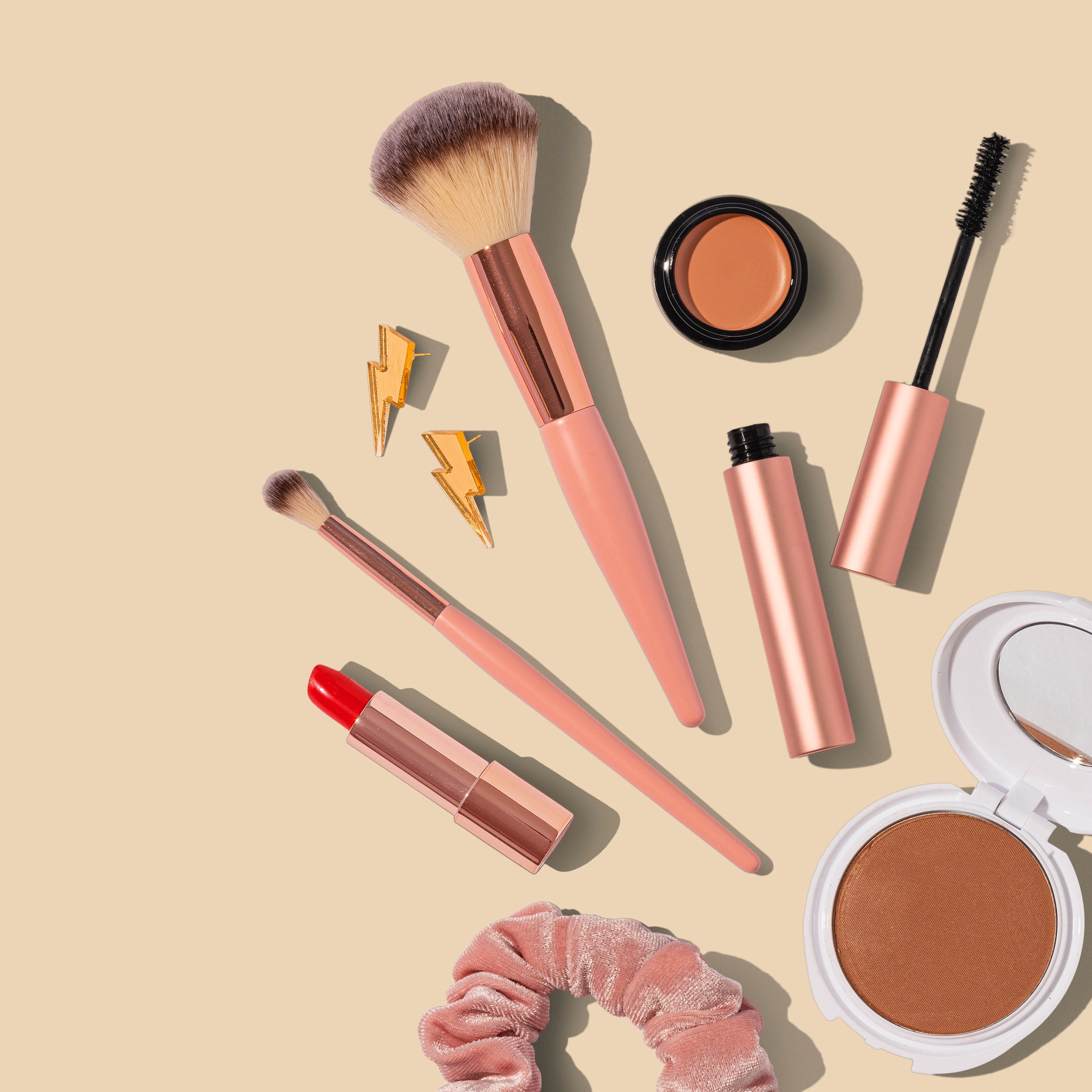 makeup brushes and lipstick